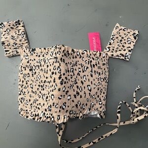 NWT animal print swim top size D/DD with crisscross back and sleeves